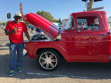 someone standing in front of a truck
